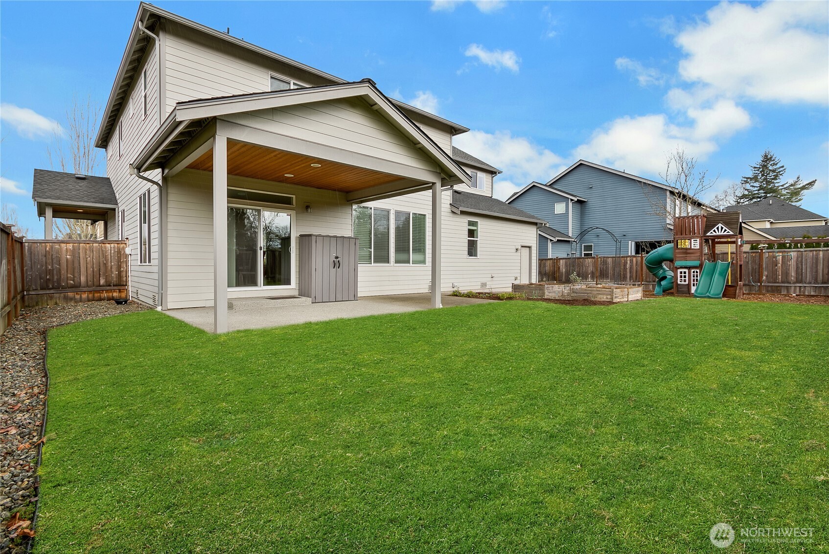 14925 Benton Loop Sumner, WA 98390 - Photo 35 of 40 a view of a house with a yard and sitting area