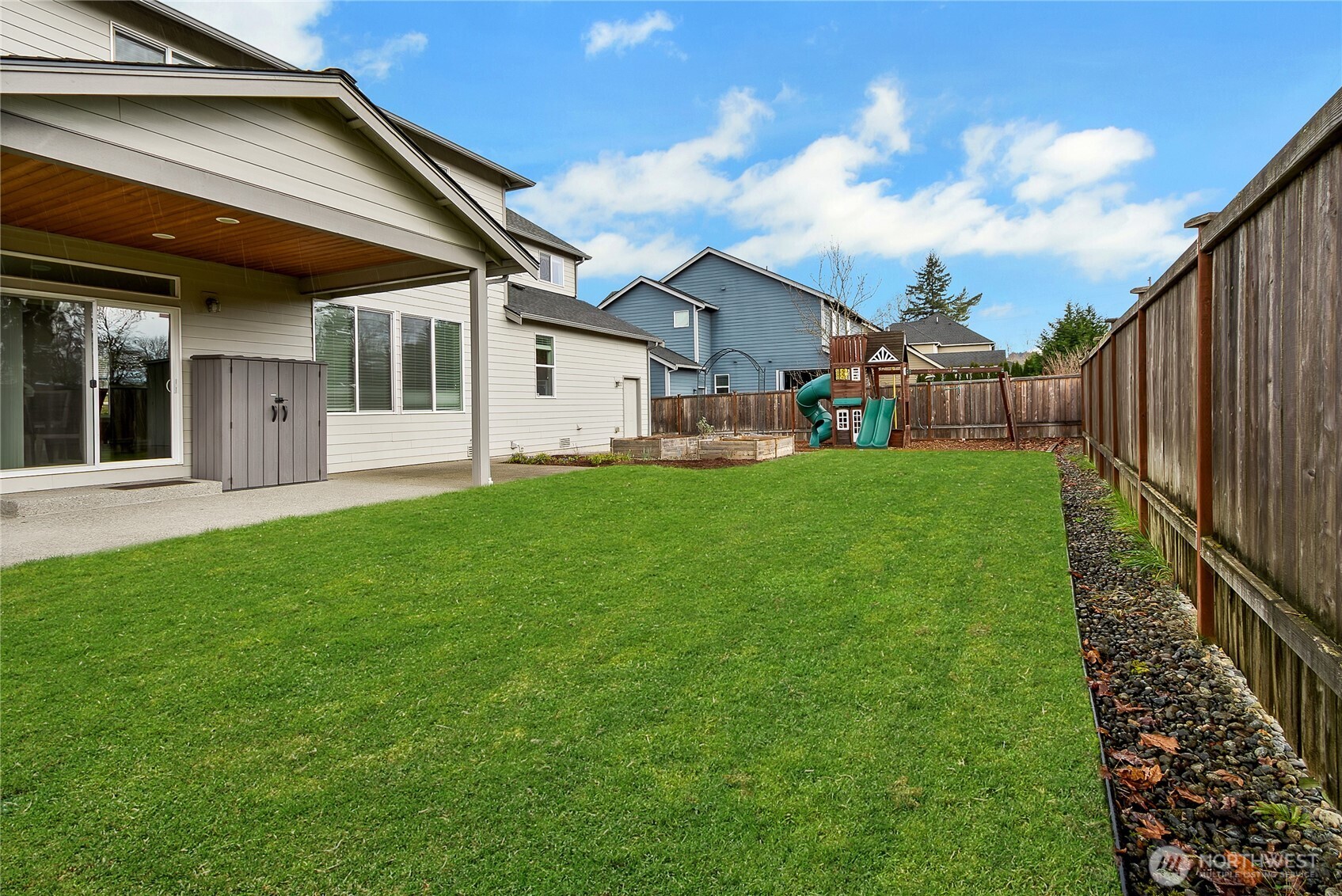 14925 Benton Loop Sumner, WA 98390 - Photo 36 of 40 a view of a house with a yard and porch