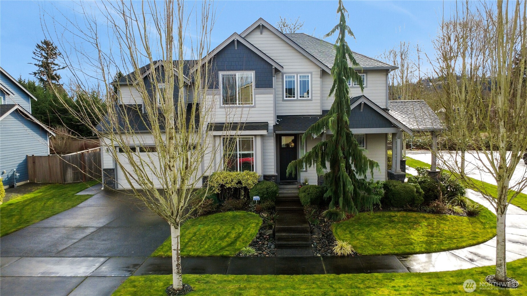 14925 Benton Loop Sumner, WA 98390 - Photo 37 of 40 a front view of a house with a garden