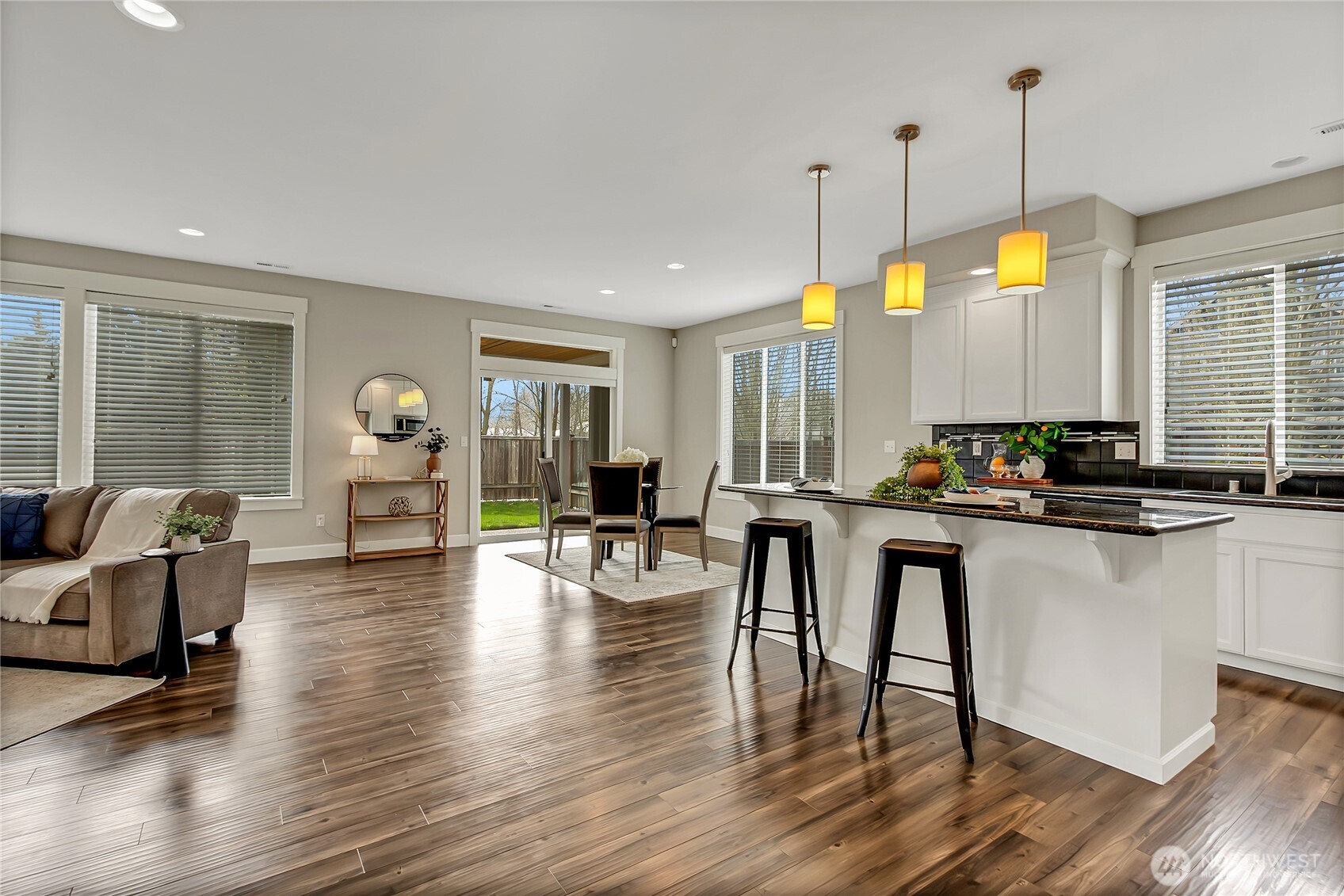 14925 Benton Loop Sumner, WA 98390 - Photo 6 of 40 a room with lots of chairs and wooden floor