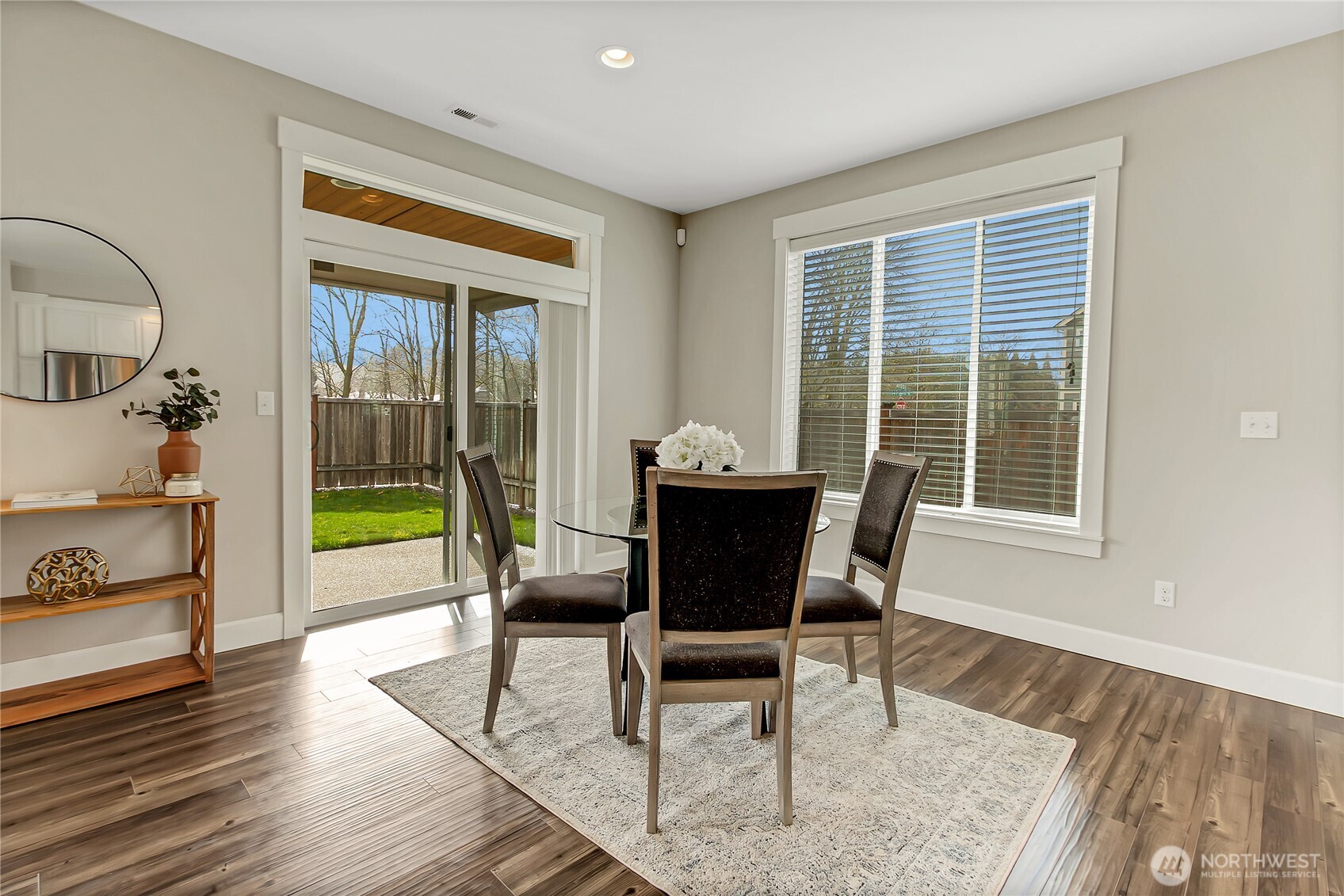 14925 Benton Loop Sumner, WA 98390 - Photo 10 of 40 a dining room with furniture and a floor to ceiling window