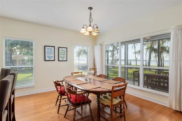 a kitchen with granite countertop white cabinets and stainless steel appliances