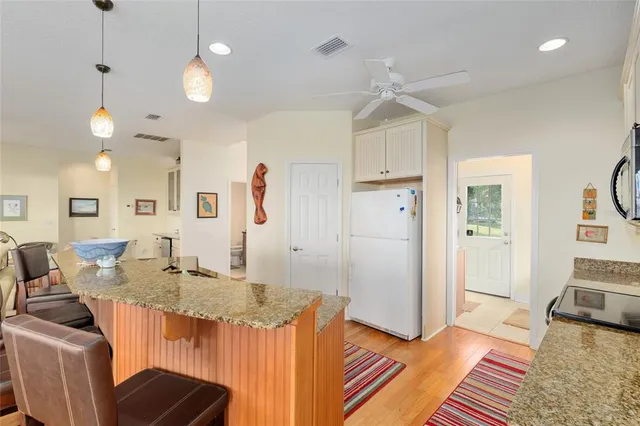a bathroom with a tub sink double vanity and a mirror