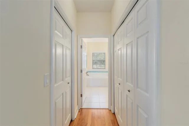 a bedroom with furniture and a ceiling fan