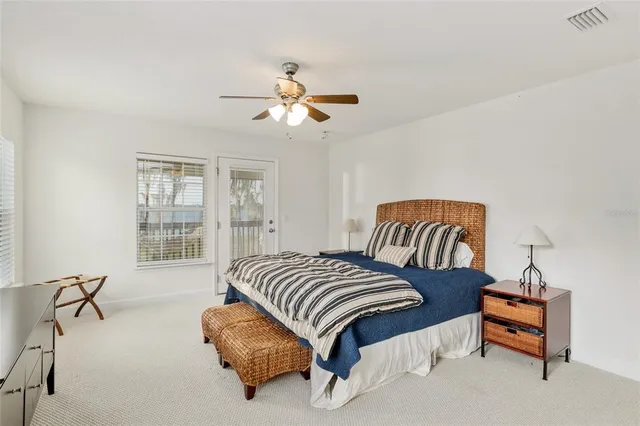 a bedroom with a bed and a table in it