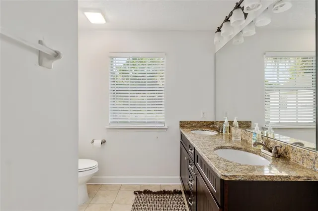 a backyard of a house with lots of green space and garden view