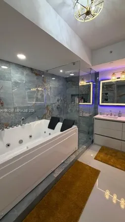 a living room with a large window and a table