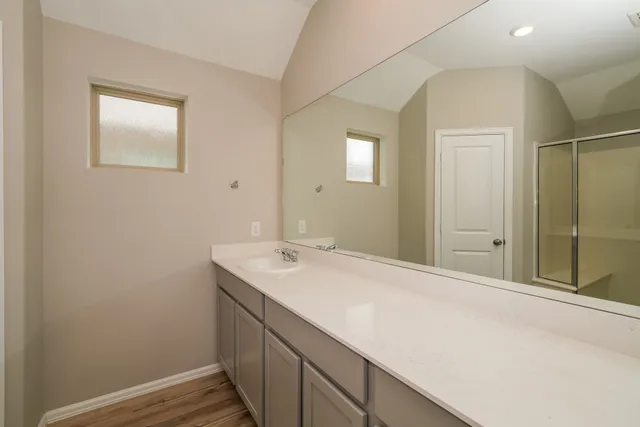 a bathroom with a sink and a mirror