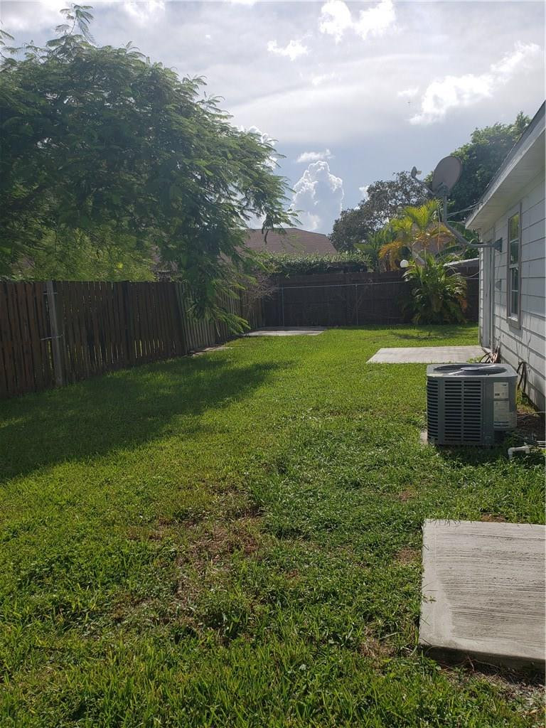 11100 North Terradas Lane Boca Raton, FL 33428 - Photo 9 of 22 a view of backyard with garden and plants