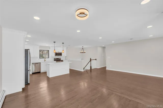 a view of kitchen with cabinets and wooden floor