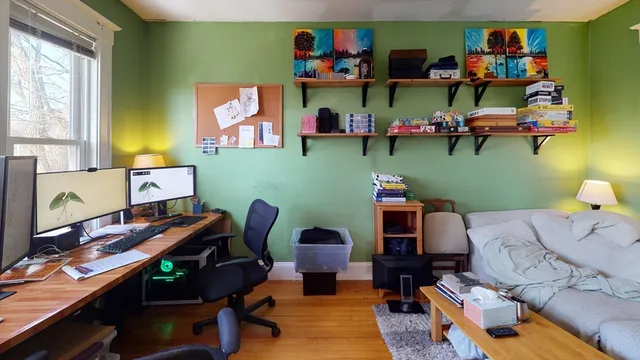 a room with furniture and a wooden floor