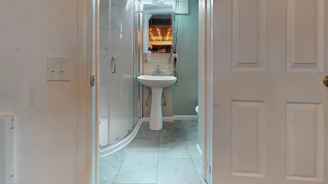 a bathroom with a sink and a mirror