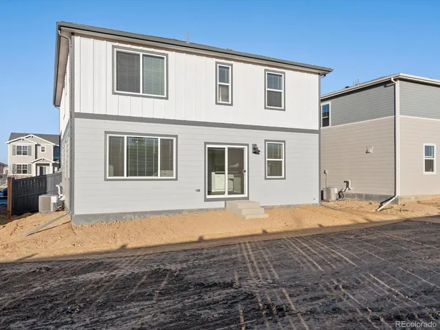 a house with trees in the background
