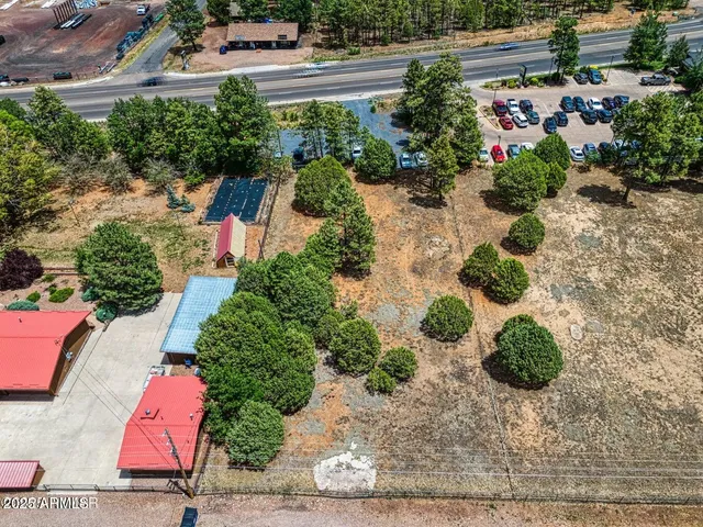 an aerial view of a house with yard