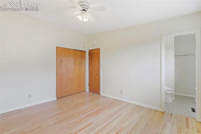 a view of an empty room and wooden floor