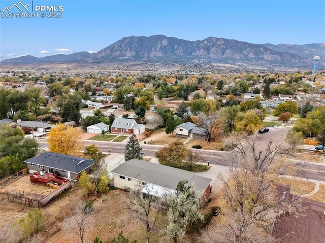 an aerial view of residential house and green space
