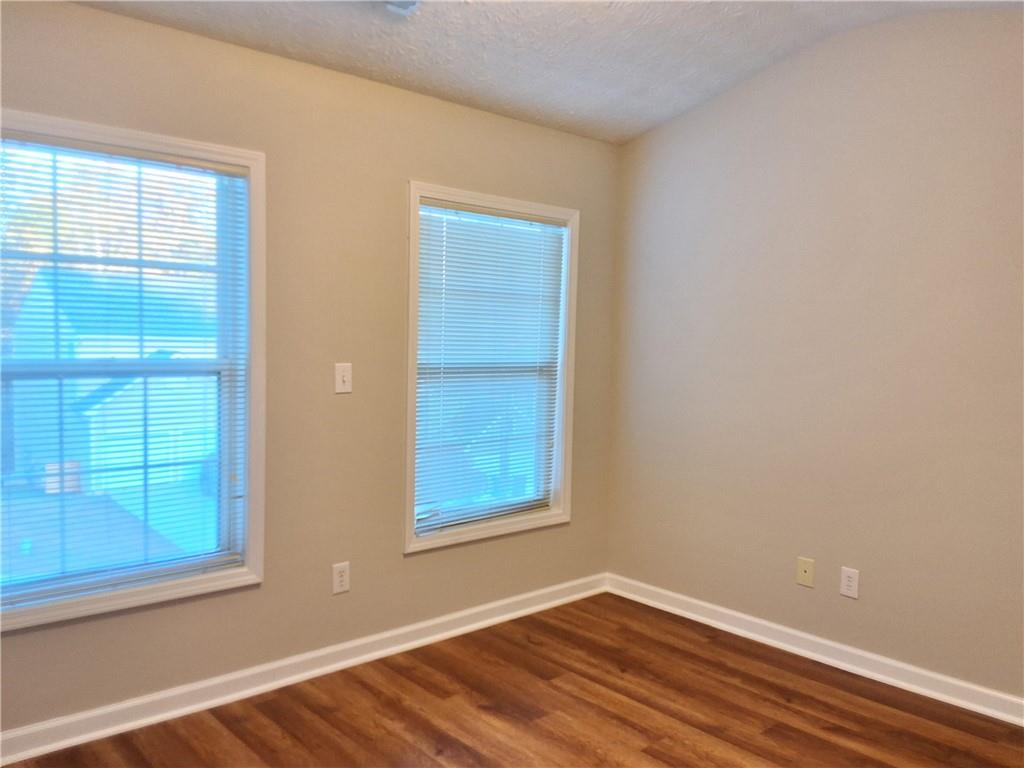 338 Alderman Trace Southwest Austell, GA 30168 - Photo 16 of 21 an empty room with window and wooden floor