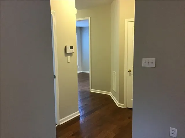 a view of a bathroom with wooden floor