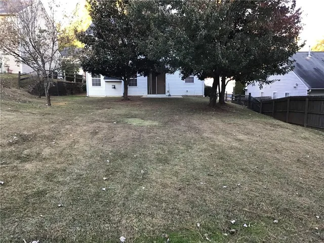 a view of a yard with a tree