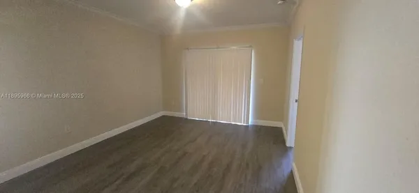 a view of kitchen with cabinets and wooden floor