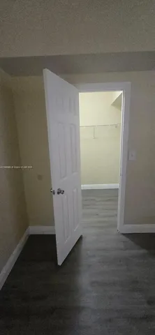 a view of a hallway view with wooden floor