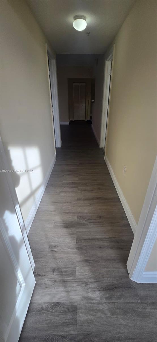 230 Southwest 117th Terrace, Unit 11208 Pembroke Pines, FL 33025 - Photo 26 of 28 a view of a hallway view with wooden floor