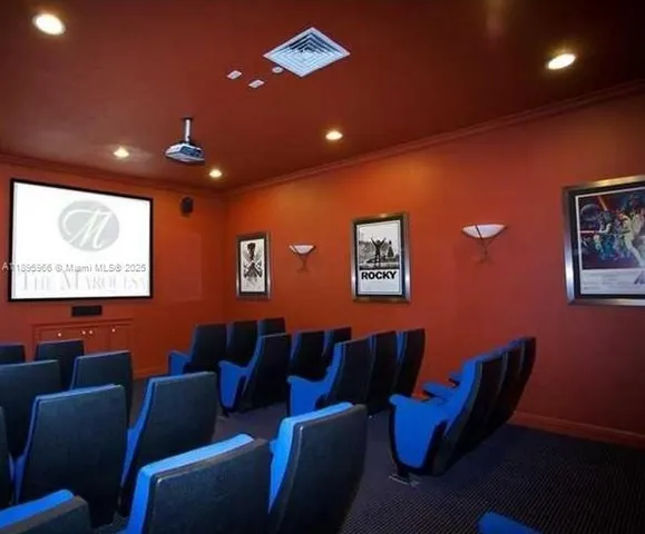 a media room with lots of chairs and a projector screen
