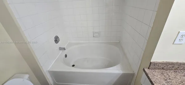 a bathroom with a toilet and a sink