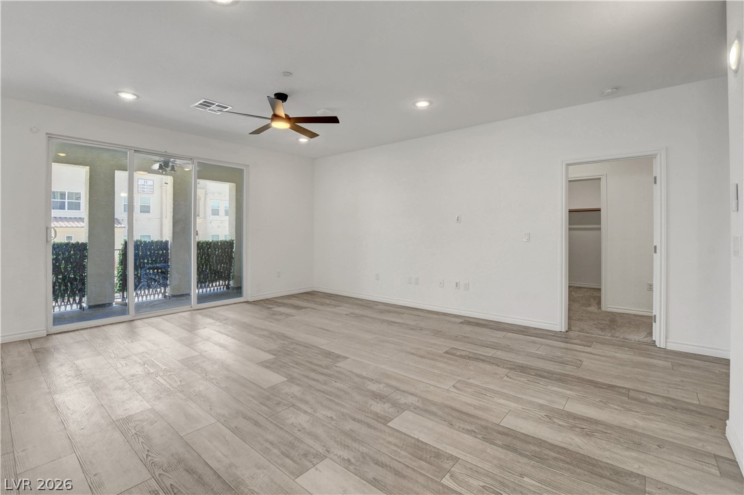2555 Hampton Road, Unit 2207 Henderson, NV 89052 - Photo 21 of 74 A welcoming living area with sliding glass doors leading to a private balcony.