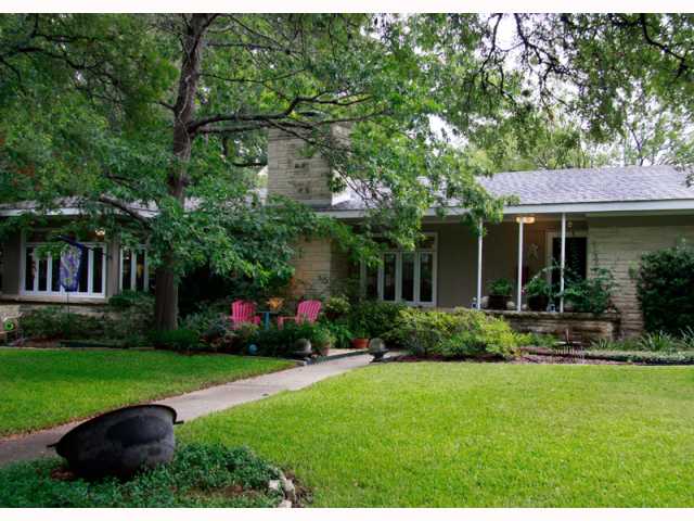 3500 Windsor Road Austin, TX 78703 - Photo 1 of 1 a view of house with a yard and potted plants and large trees