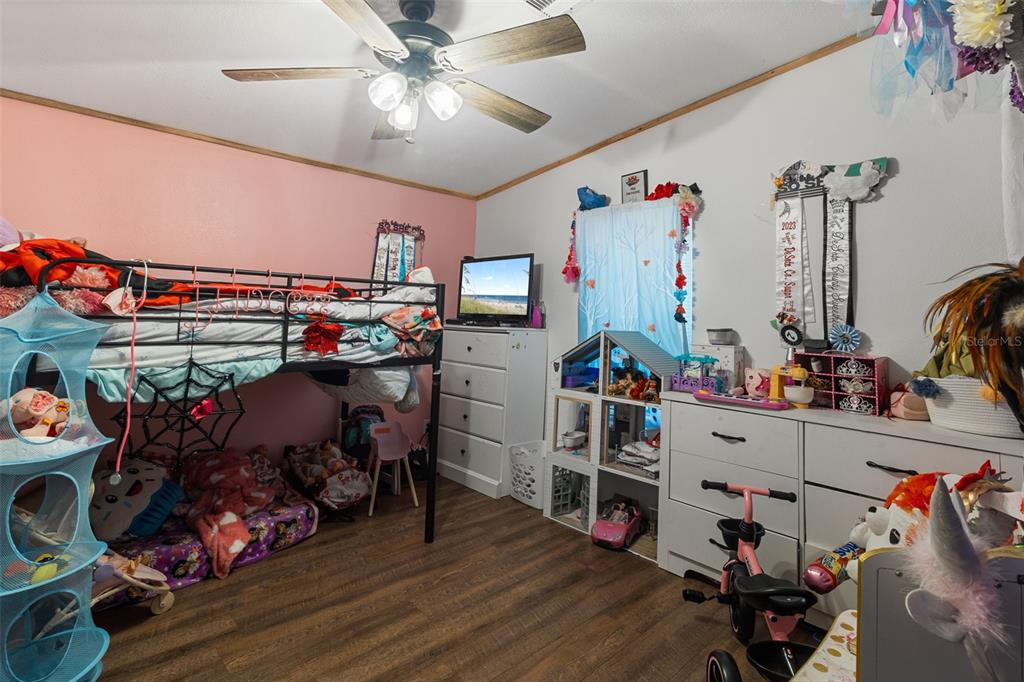 575 Bronco Road Zolfo Springs, FL 33890 - Photo 11 of 22 a view of a workspace with furniture and toys