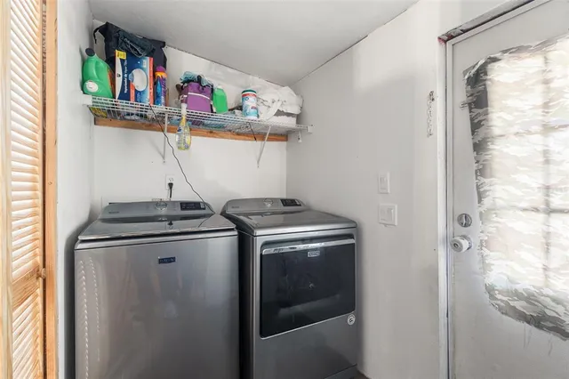 a utility room with dryer and washer