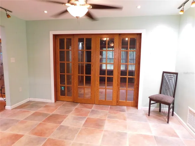 a view of empty room with wooden floor and fireplace