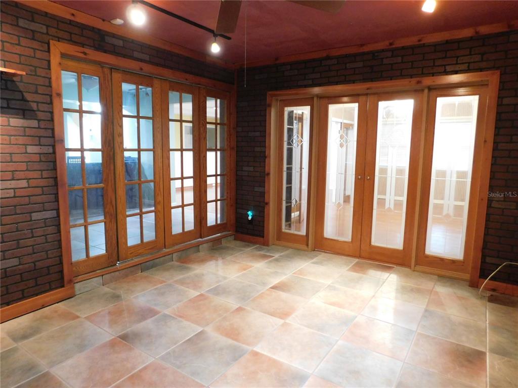 888 Forest Glen Road Clearwater, FL 33765 - Photo 21 of 61 a view of an empty room with a balcony