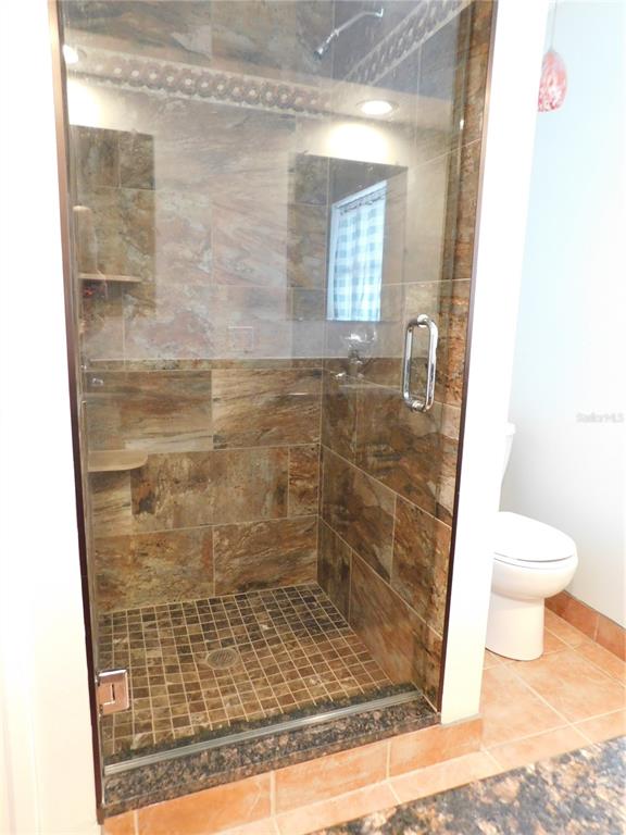 888 Forest Glen Road Clearwater, FL 33765 - Photo 29 of 61 a bathroom with a shower