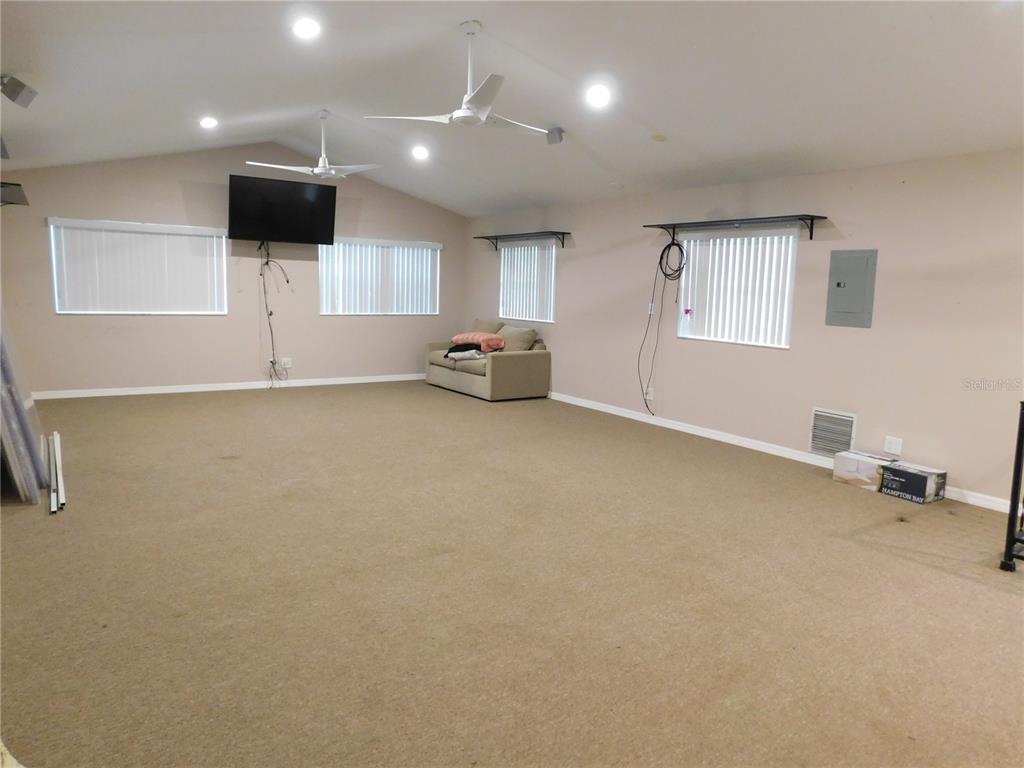 888 Forest Glen Road Clearwater, FL 33765 - Photo 33 of 61 an empty room with ceiling fan and window