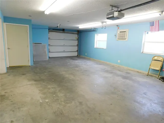 a view of a balcony with wooden fence and trees
