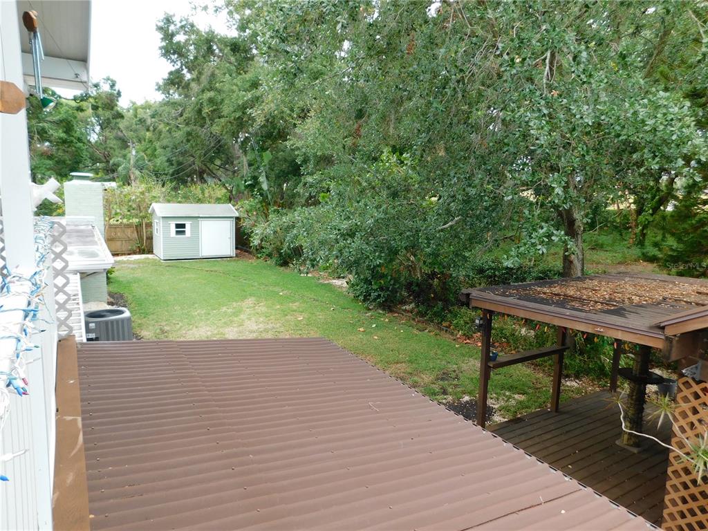 888 Forest Glen Road Clearwater, FL 33765 - Photo 41 of 61 a view of a terrace with a bench
