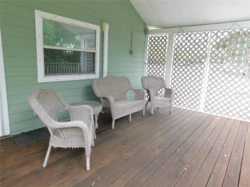 888 Forest Glen Road Clearwater, FL 33765 - Photo 42 of 61 a living room with furniture and a wooden floor