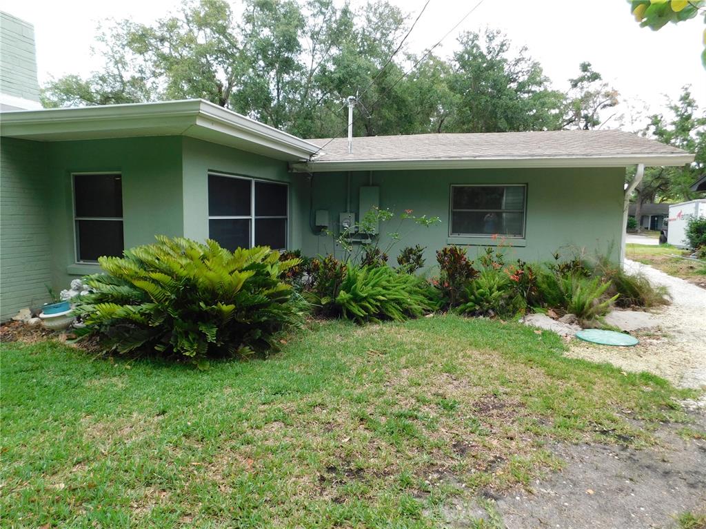 888 Forest Glen Road Clearwater, FL 33765 - Photo 45 of 61 a view of a house with a garden