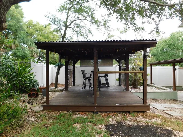 a view of a house with a yard porch and sitting area