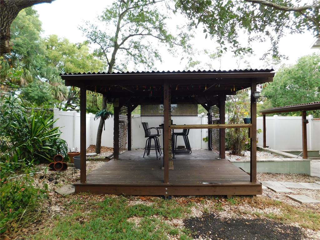 888 Forest Glen Road Clearwater, FL 33765 - Photo 46 of 61 a view of a swimming pool with a patio