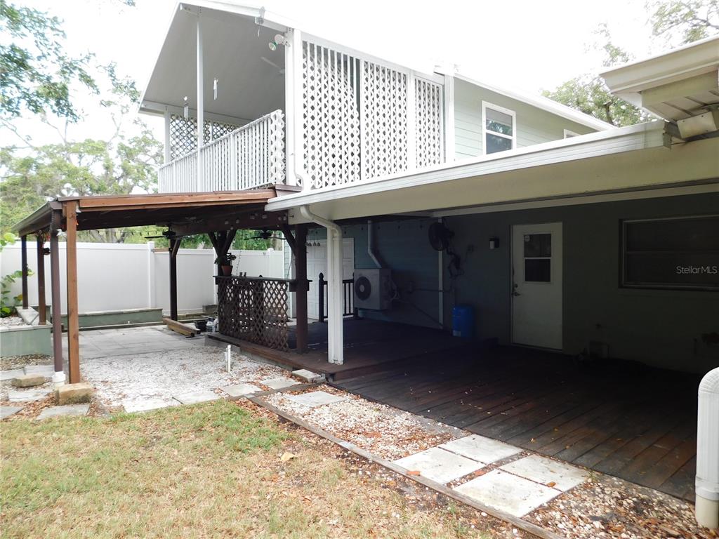 888 Forest Glen Road Clearwater, FL 33765 - Photo 52 of 61 a view of a house with a patio