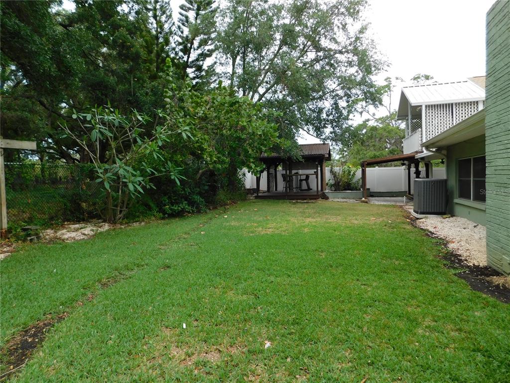 888 Forest Glen Road Clearwater, FL 33765 - Photo 55 of 61 a view of a house with a yard porch and sitting area