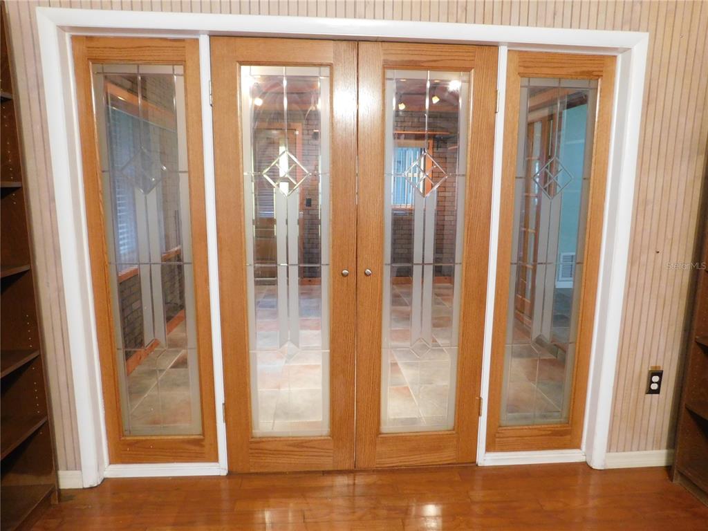 888 Forest Glen Road Clearwater, FL 33765 - Photo 9 of 61 a view of a glass door with glass door