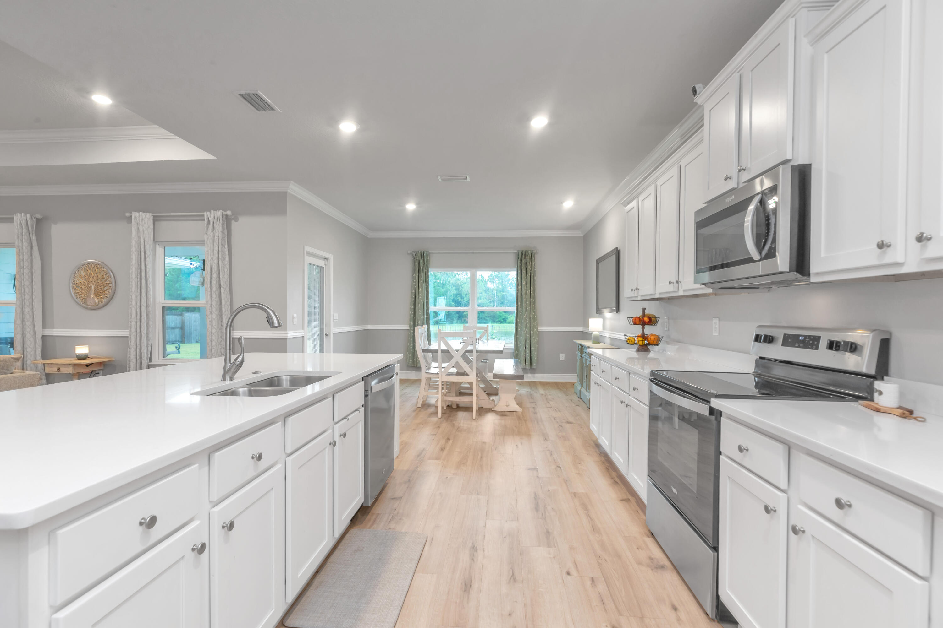 18 Hammock Circle Freeport, FL 32439 - Photo 11 of 50 a large kitchen with stainless steel appliances lots of counter space and a sink