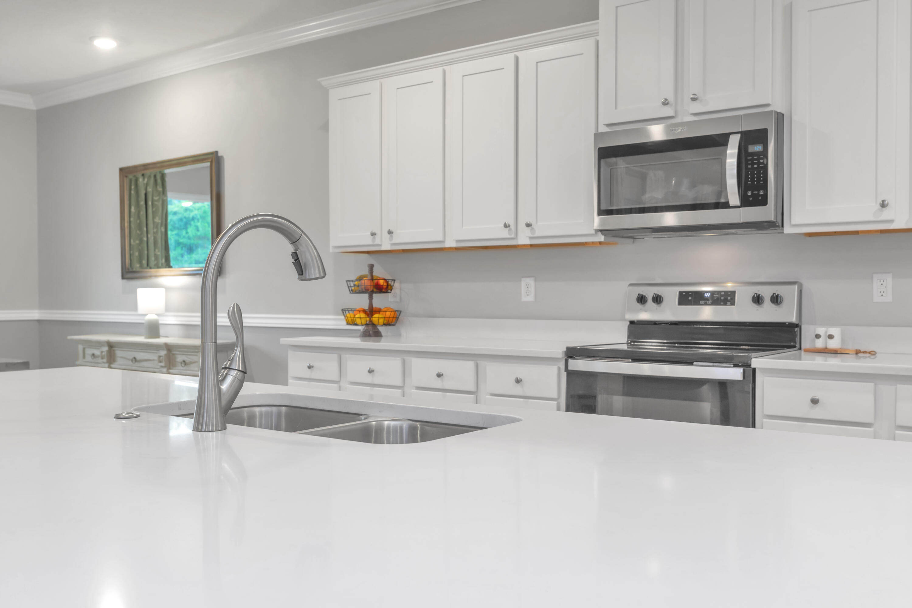 18 Hammock Circle Freeport, FL 32439 - Photo 14 of 50 a kitchen with stainless steel appliances granite countertop a sink a stove and cabinets