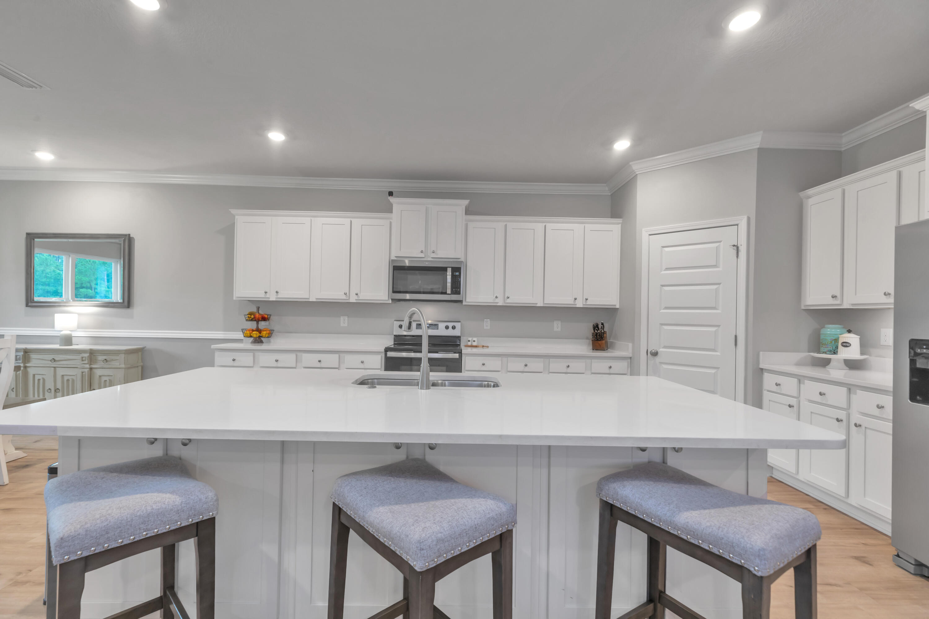 18 Hammock Circle Freeport, FL 32439 - Photo 15 of 50 a kitchen with appliances a sink and cabinets