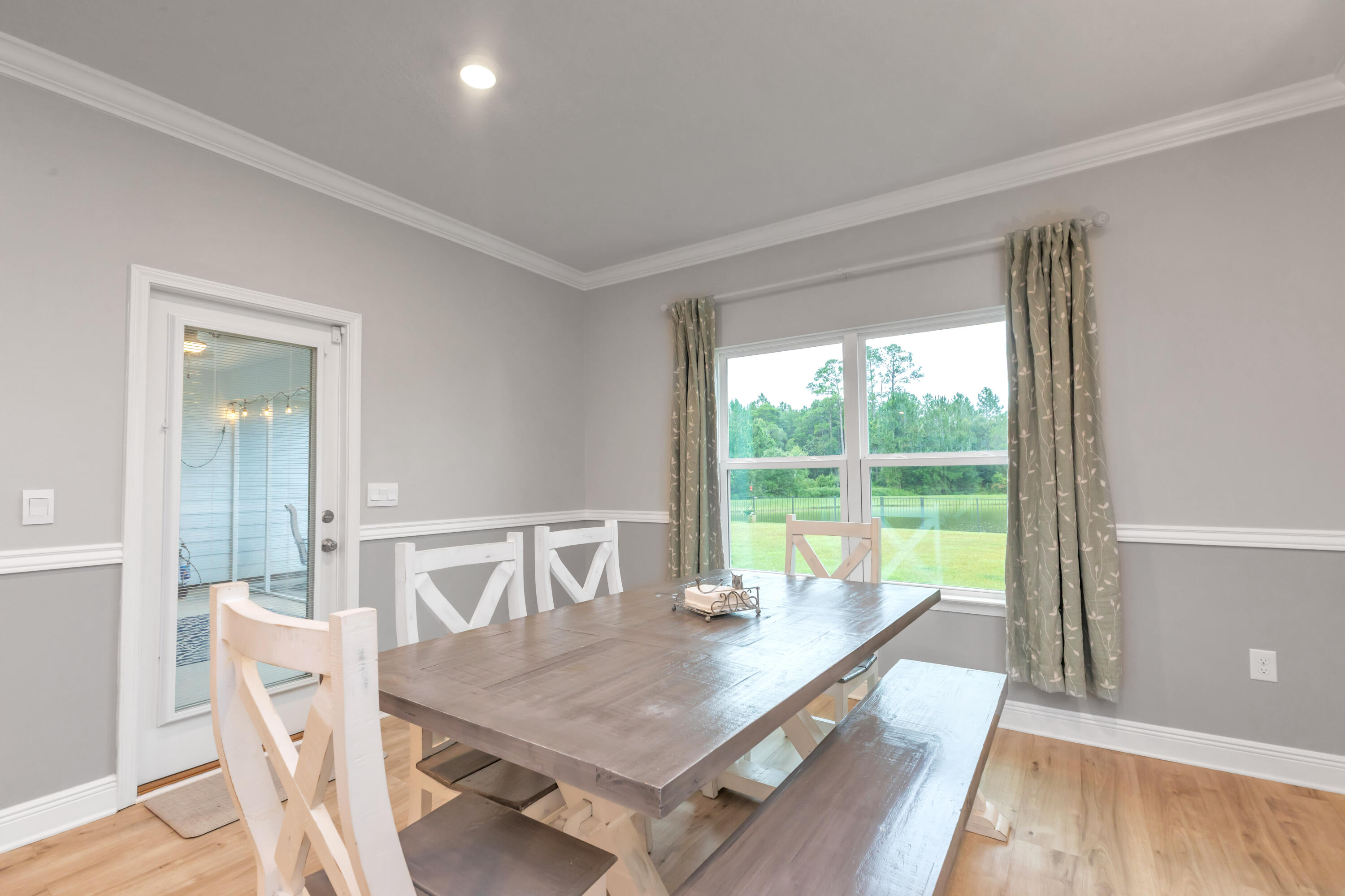 18 Hammock Circle Freeport, FL 32439 - Photo 16 of 50 a view of a dining room with furniture window and wooden floor