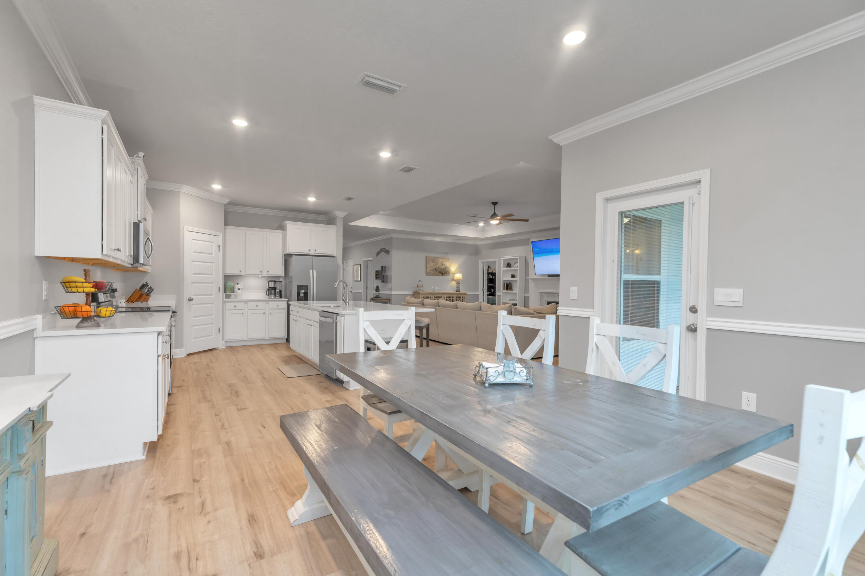 18 Hammock Circle Freeport, FL 32439 - Photo 17 of 50 a kitchen with stainless steel appliances granite countertop a refrigerator a sink a stove and oven with wooden floor